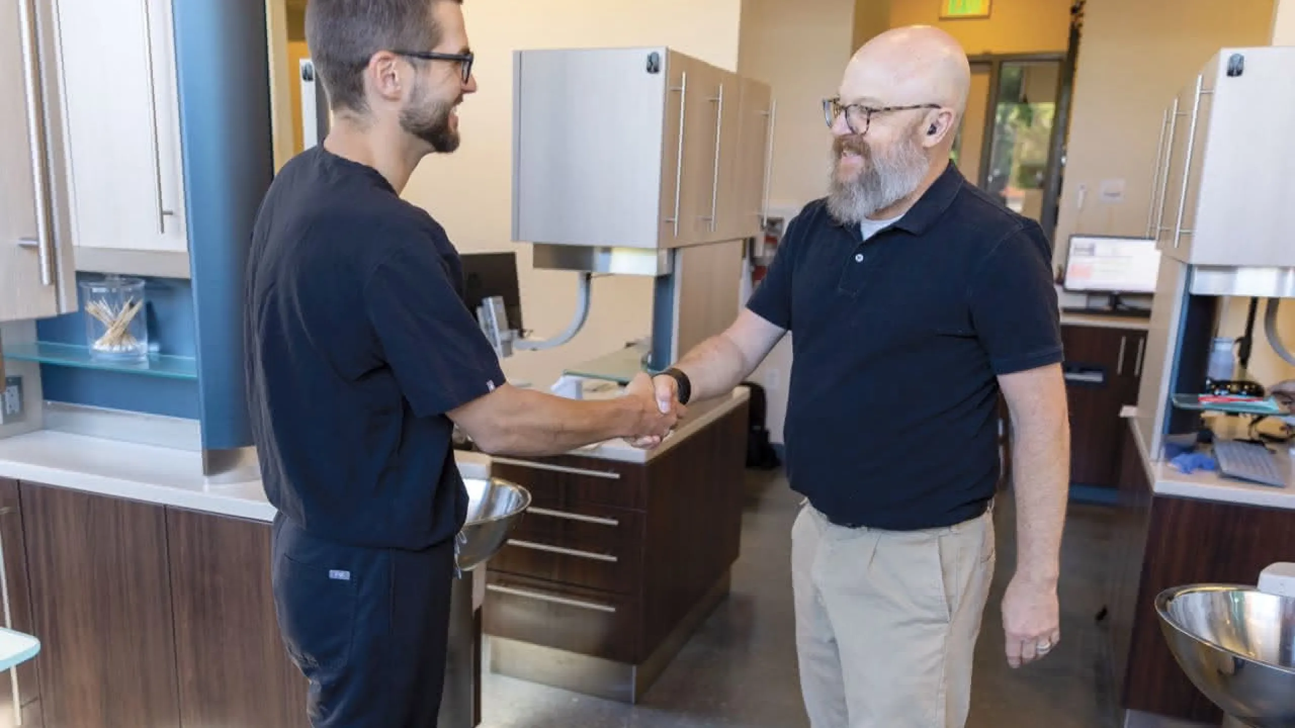 A doctor shaking hands with a patient