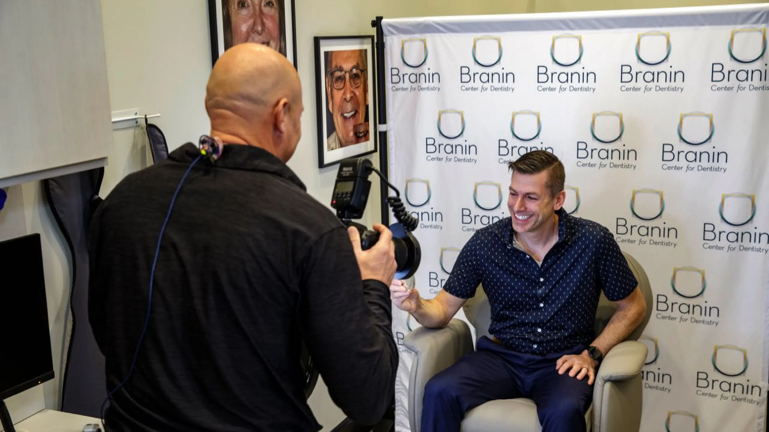Dr. Dudley taking a photo of a patient smiling