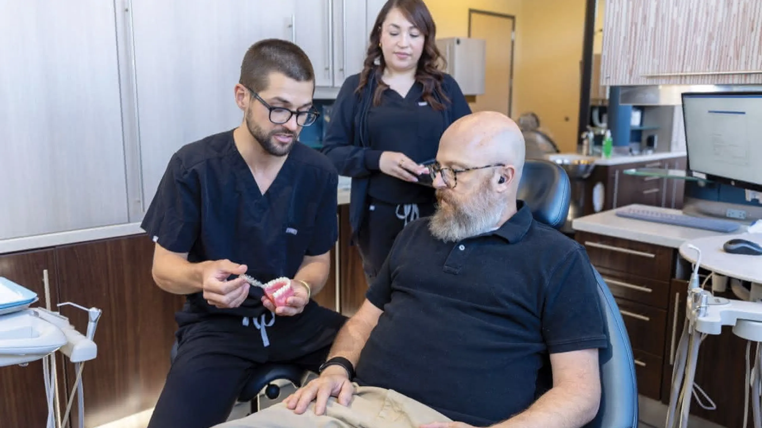 A patient listening to a doctor explain a procedure