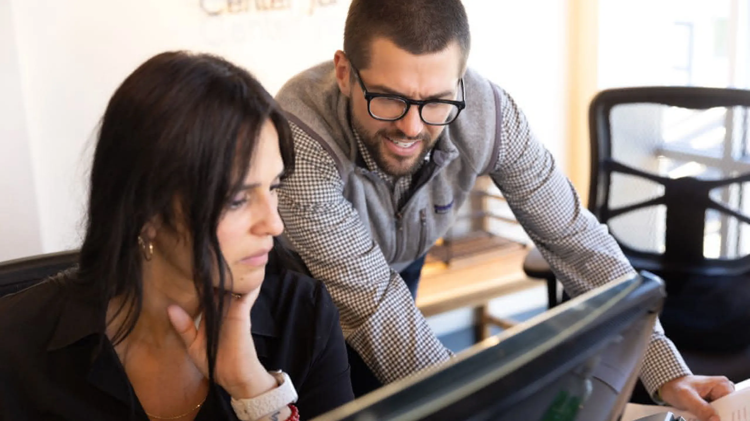 Two doctors looking at a computer monitor