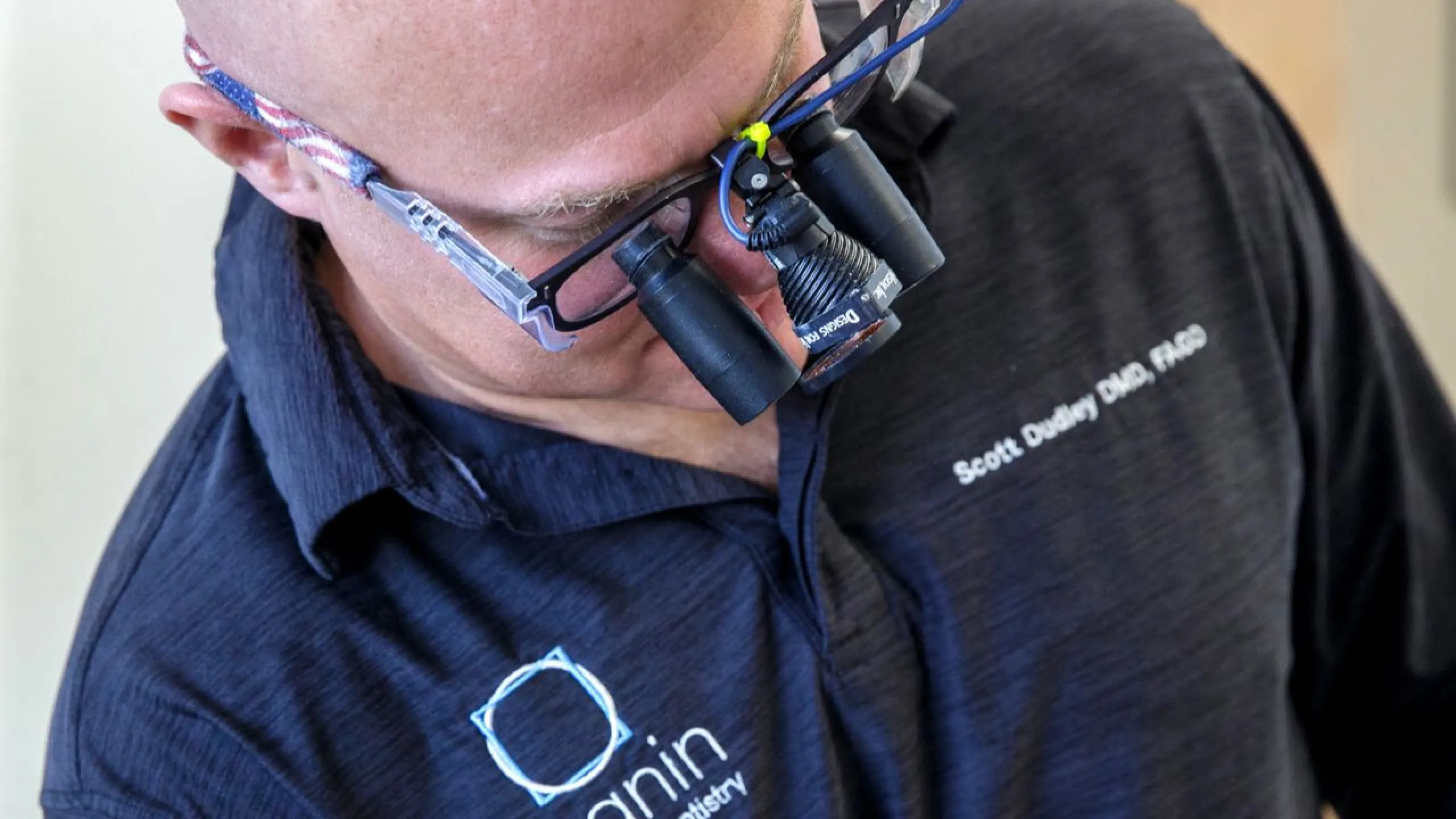 Dr. Dudley examining a patient wearing latest technology