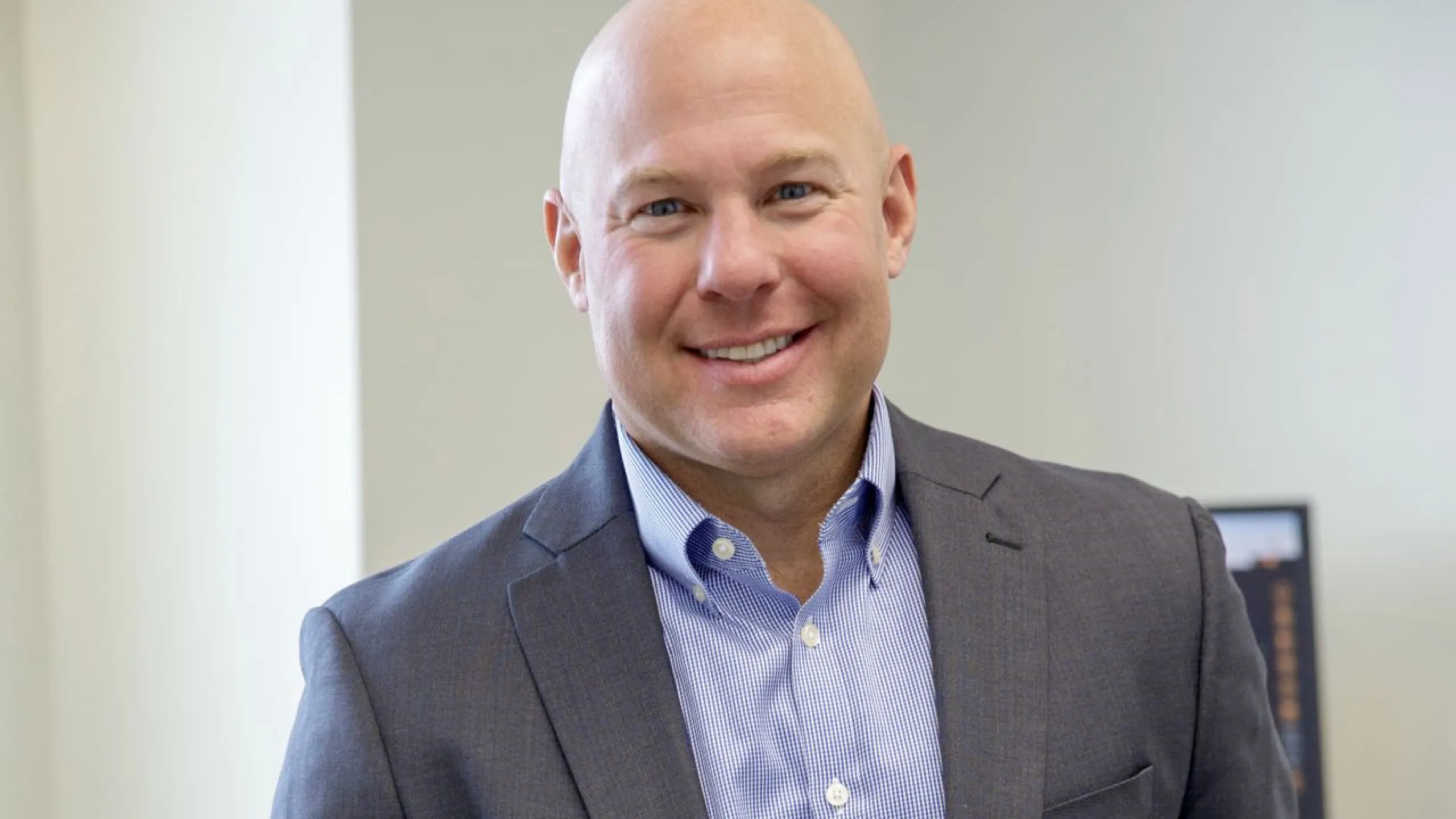 Dr. Scott Dudley in front of a white wall