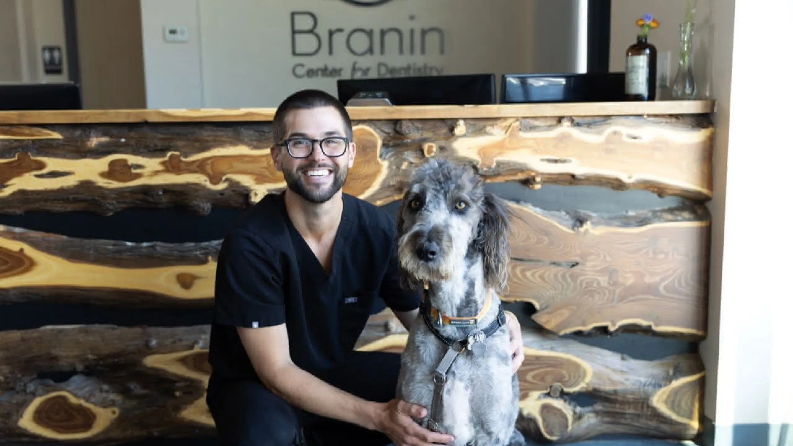 Adam with dog in the lobby