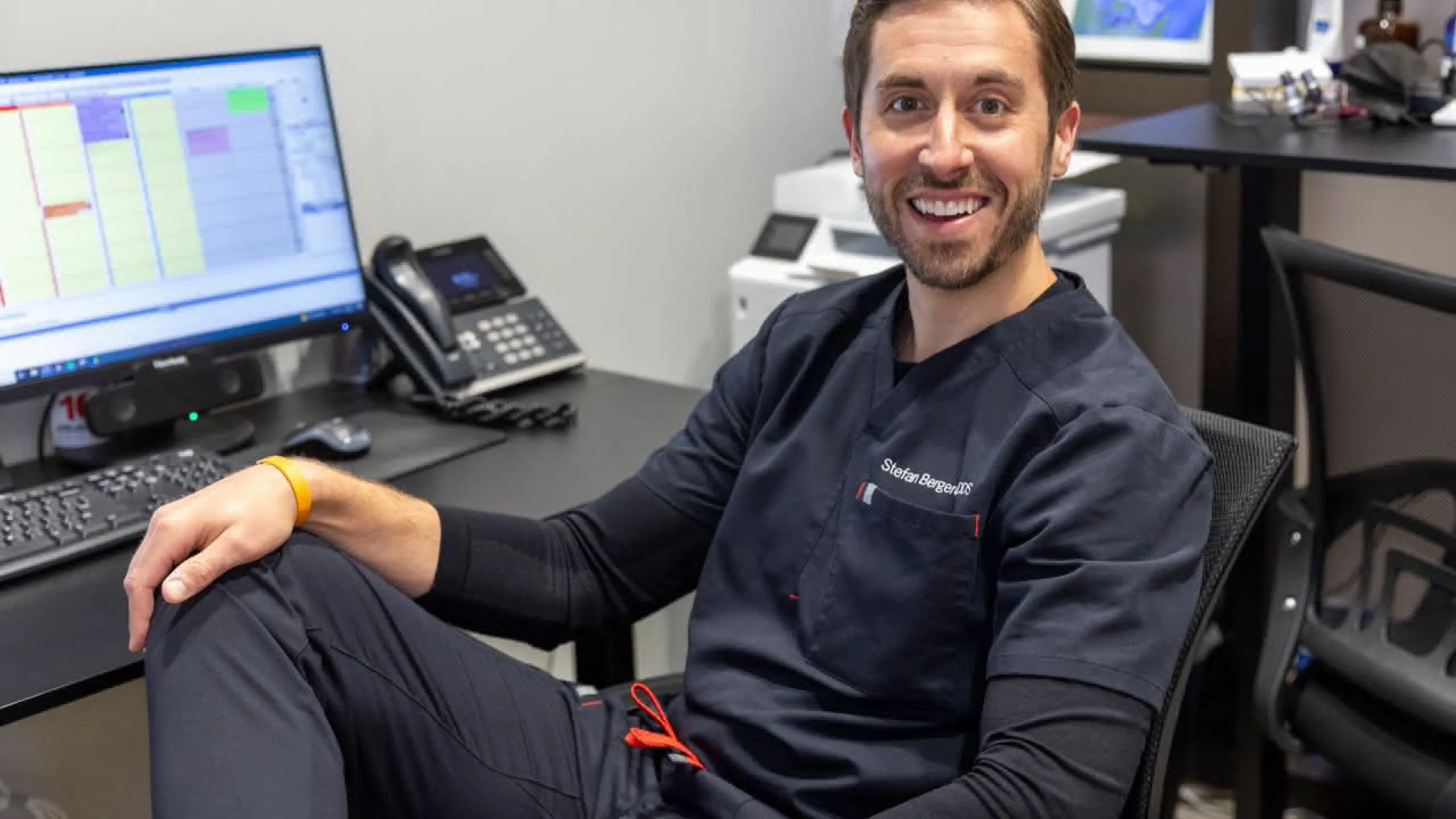 Dr. Berghoff sitting in a chair smiling