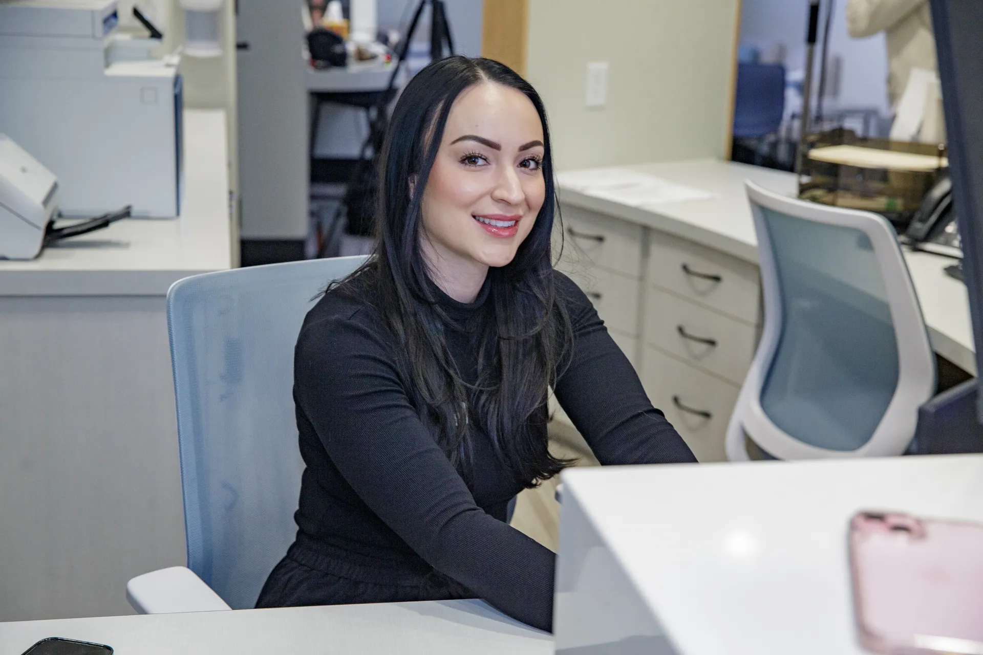A smiling employee at Branin Center