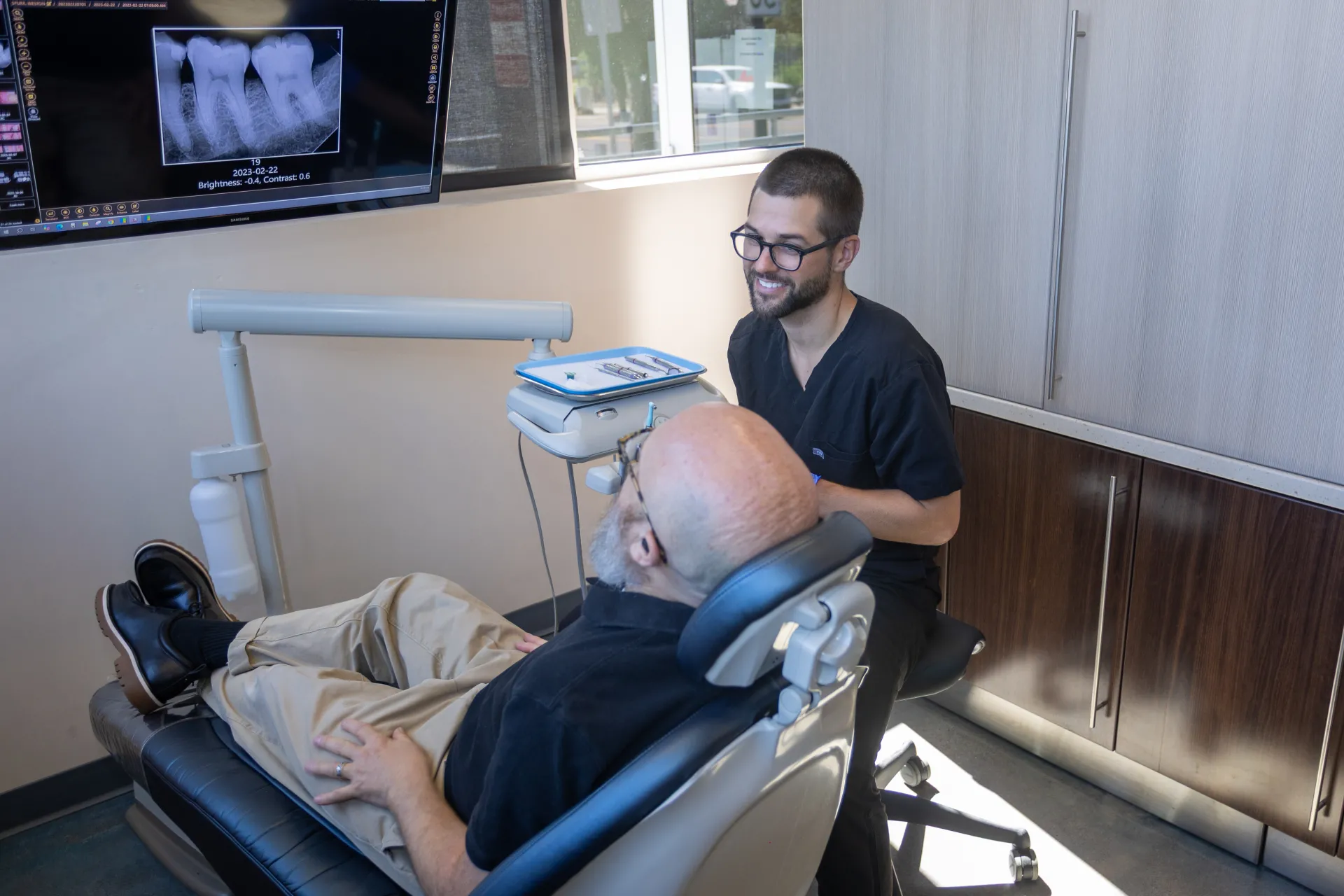 Dr. Staffen chatting with a patient