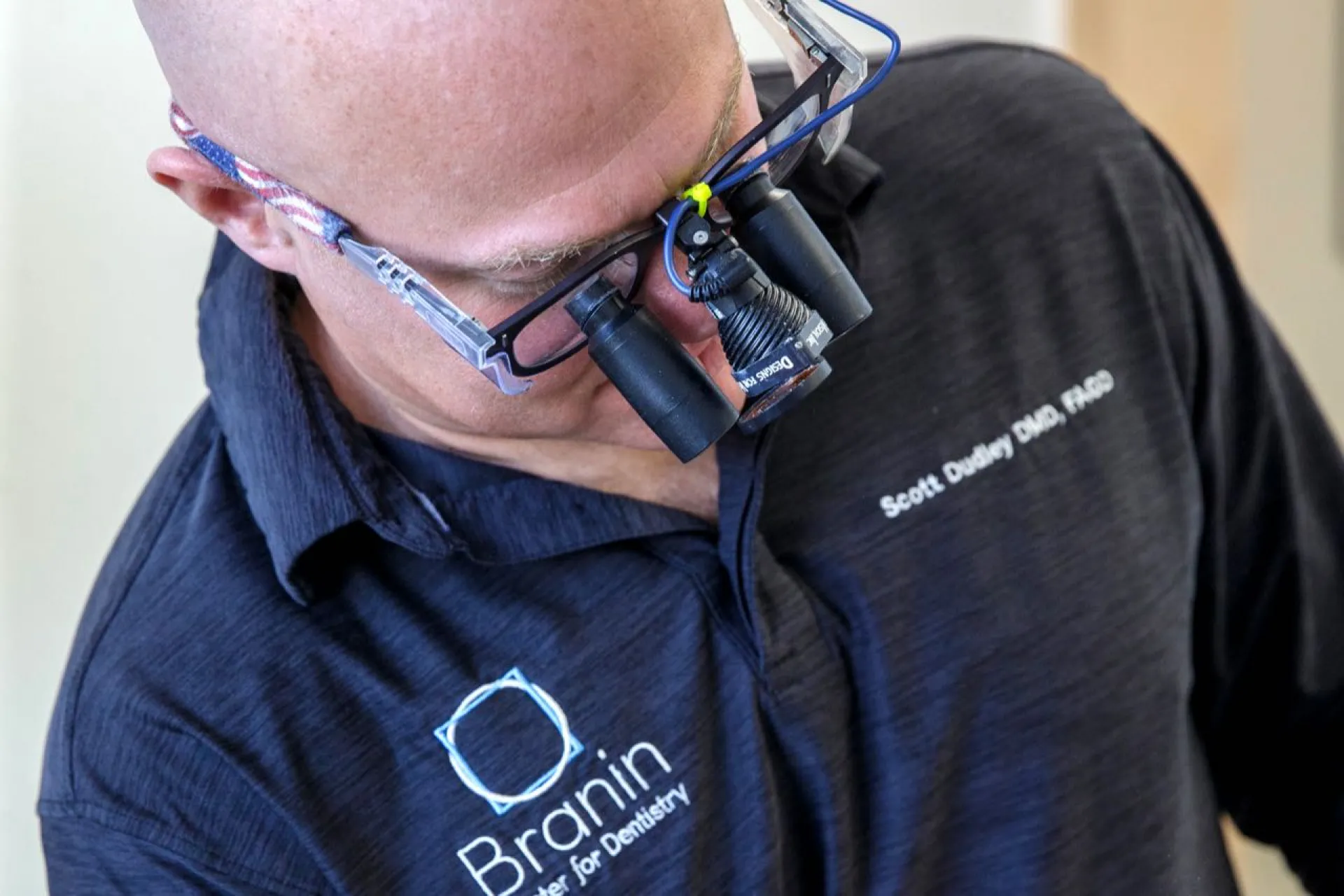 Dr. Dudley examining a patient wearing latest technology