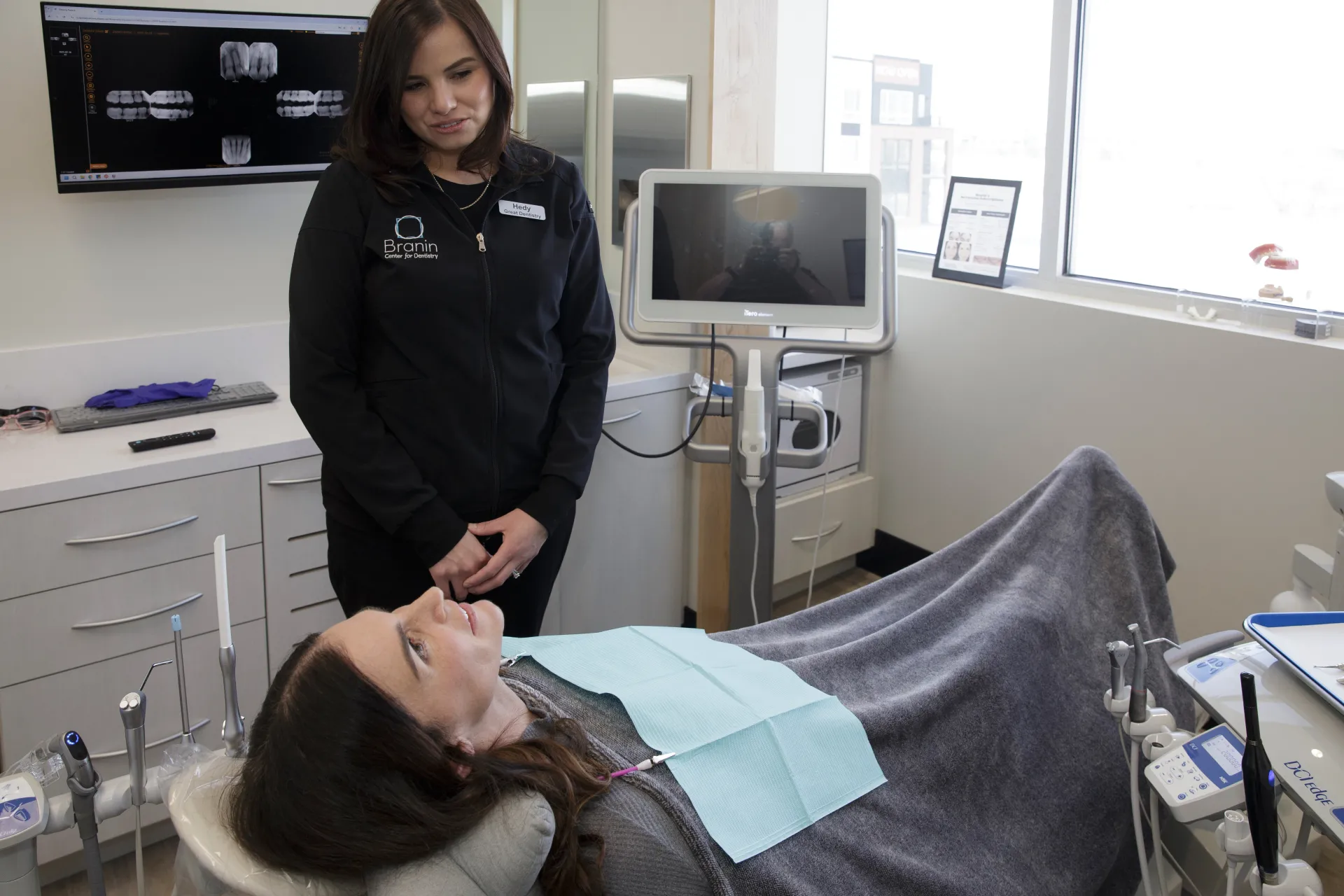 A patient laying in an exam chair