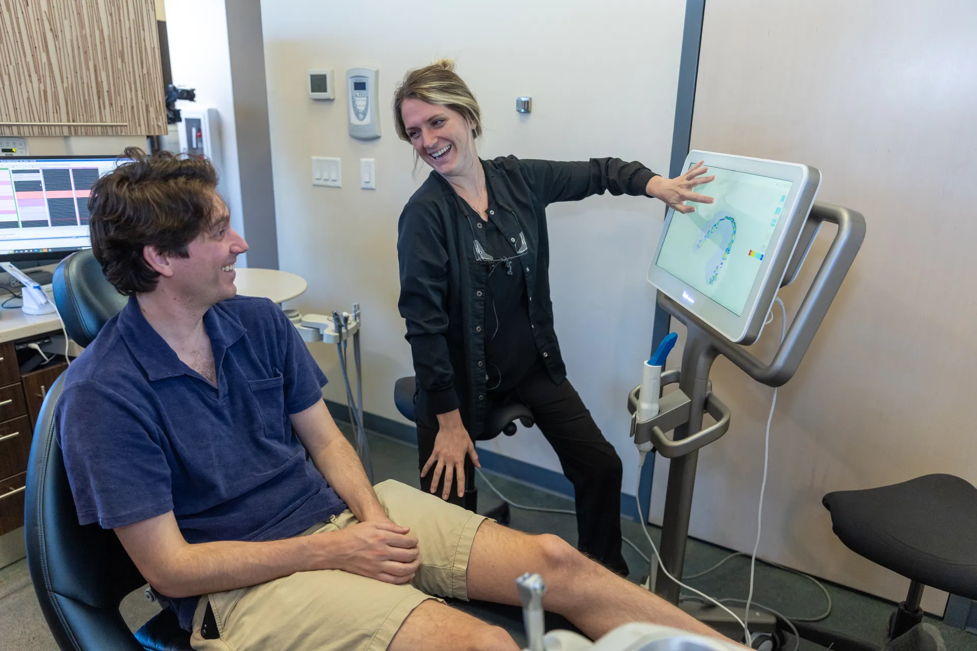 A patient and hygienist exchanging a conversation 