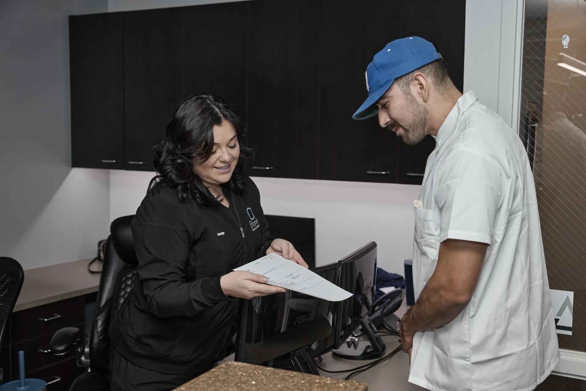 Employee helping a patient