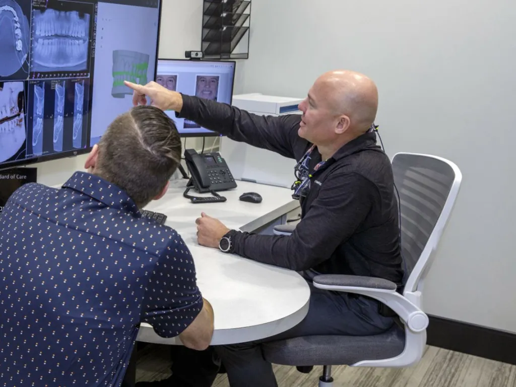 Dr. Dudley explains a procedure to a patient