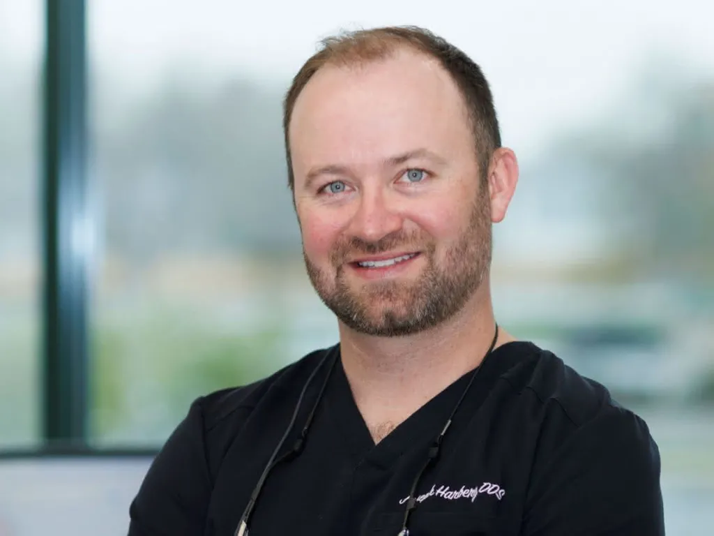 Dr. Harberg in front of a window