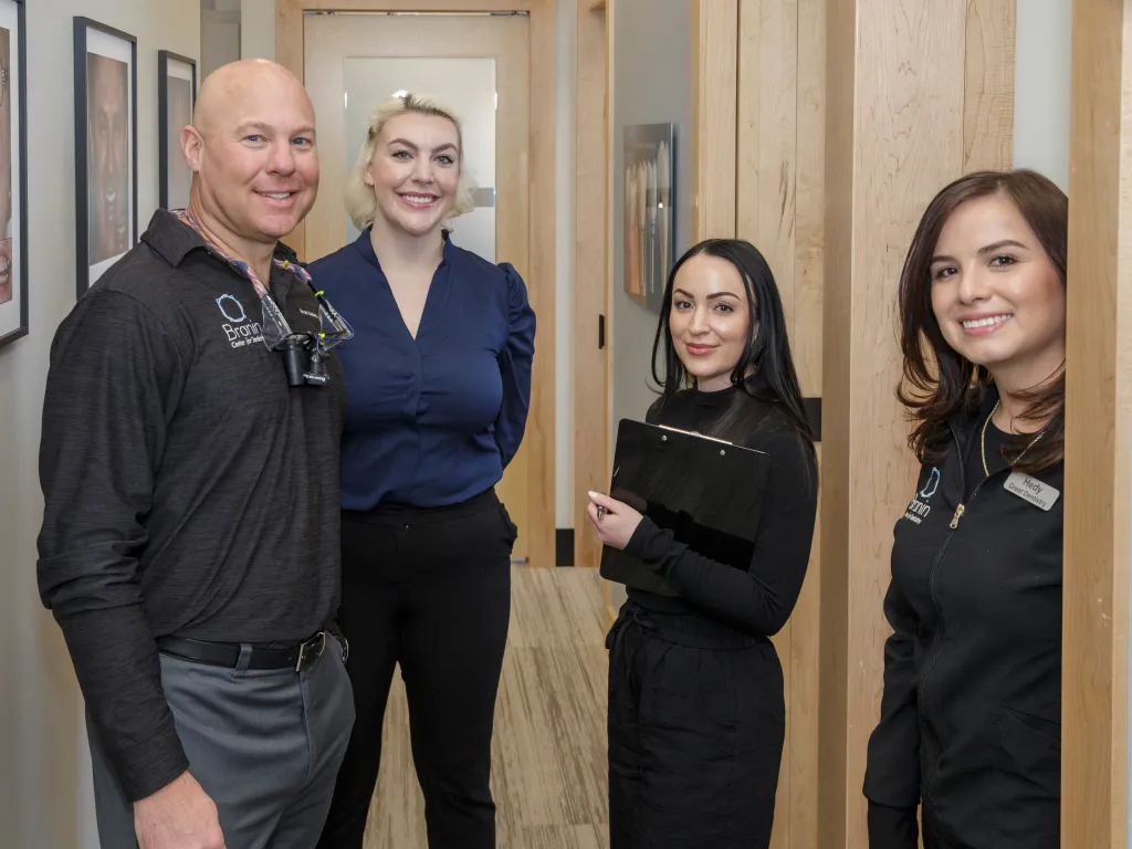 Dr. Dudley, Dr. Sesson and a few other team members of superior smiling.