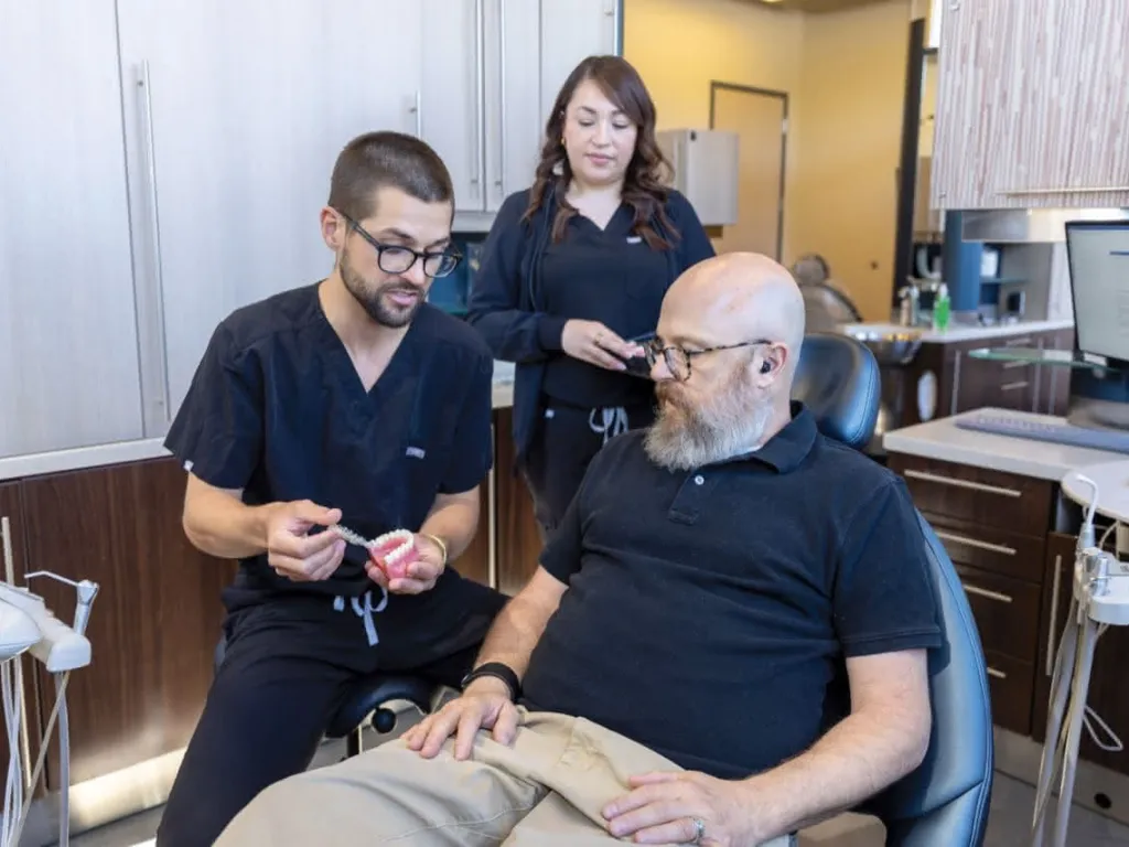 A patient listening to a doctor explain a procedure