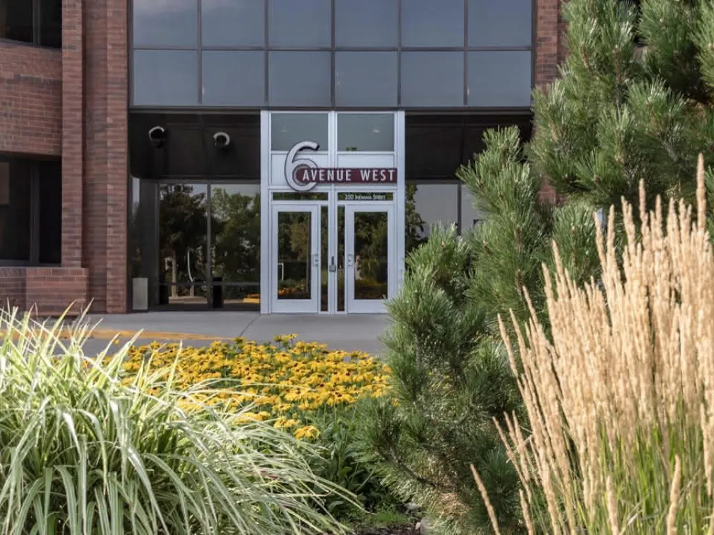 The office in Golden, CO from behind plants