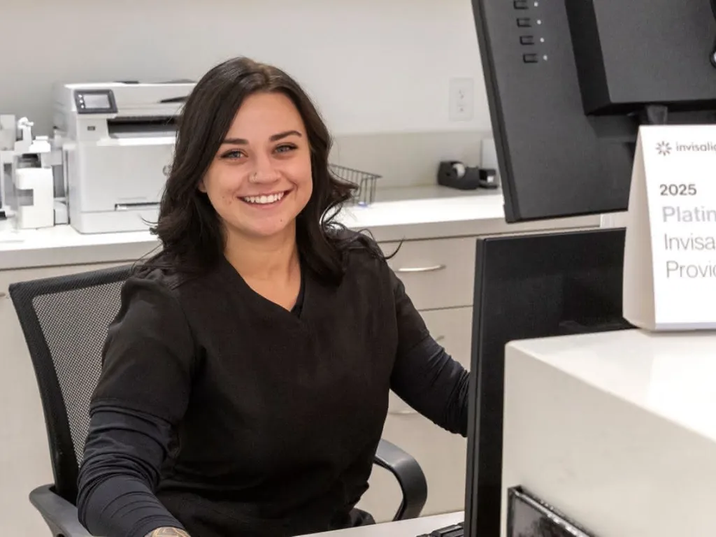 Staff member working at a computer