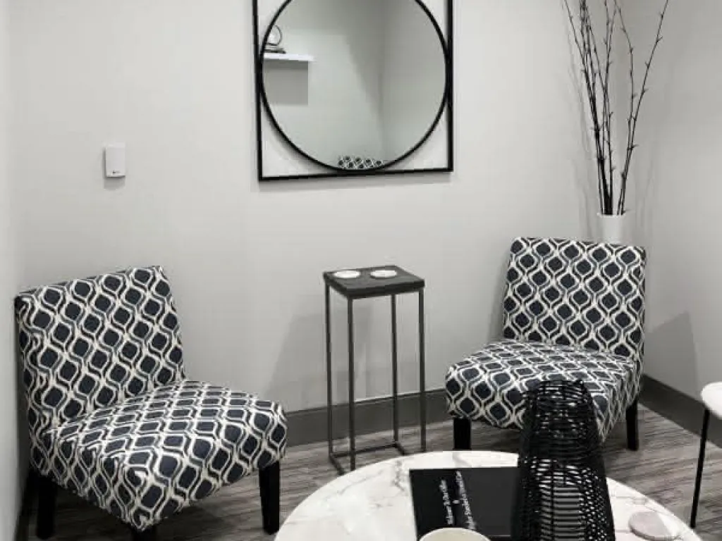 Lobby with two black and white chairs