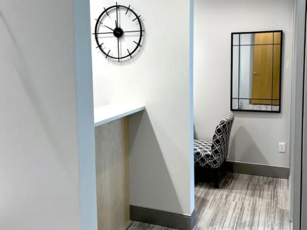 Hallway with black and white striped carpet