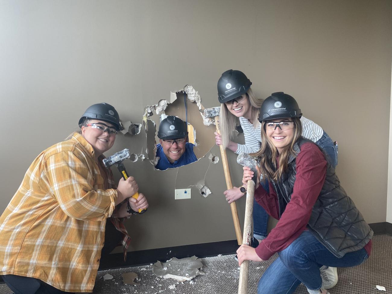 Staff taking part in demolition for the construction of Branin Center for Dentistry. 