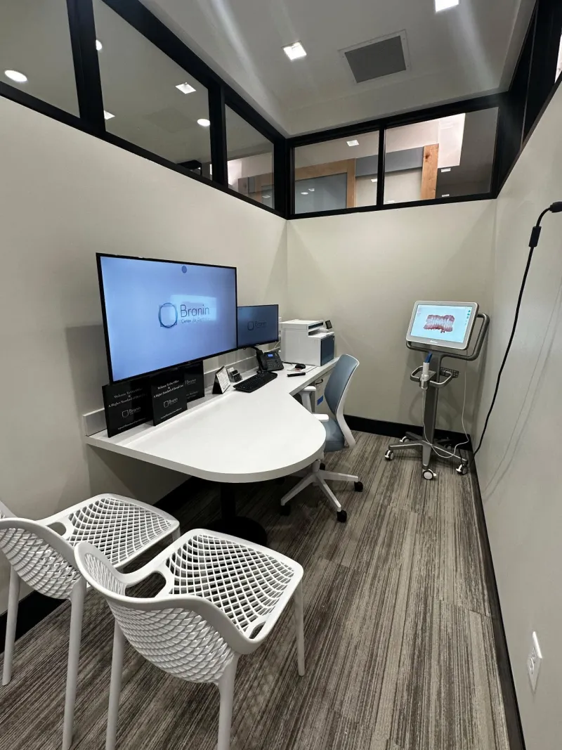 Two white chairs and a white desk