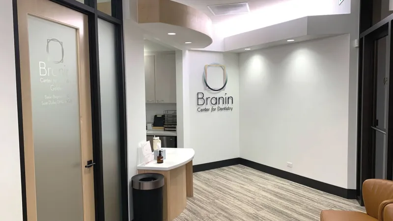 Waiting area with company logo on a white wall