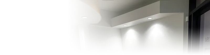 A light grey wall with inset lighting
