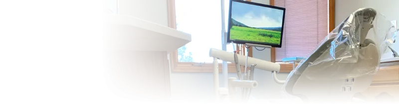 An exam chair in front of a window